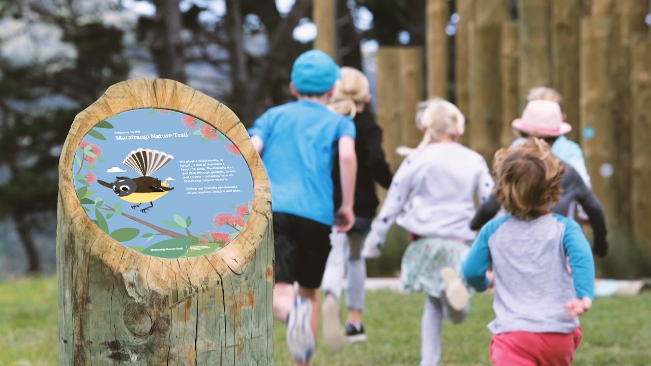 An interpretive sign on a grassy reserve, part of a wider park upgrade.